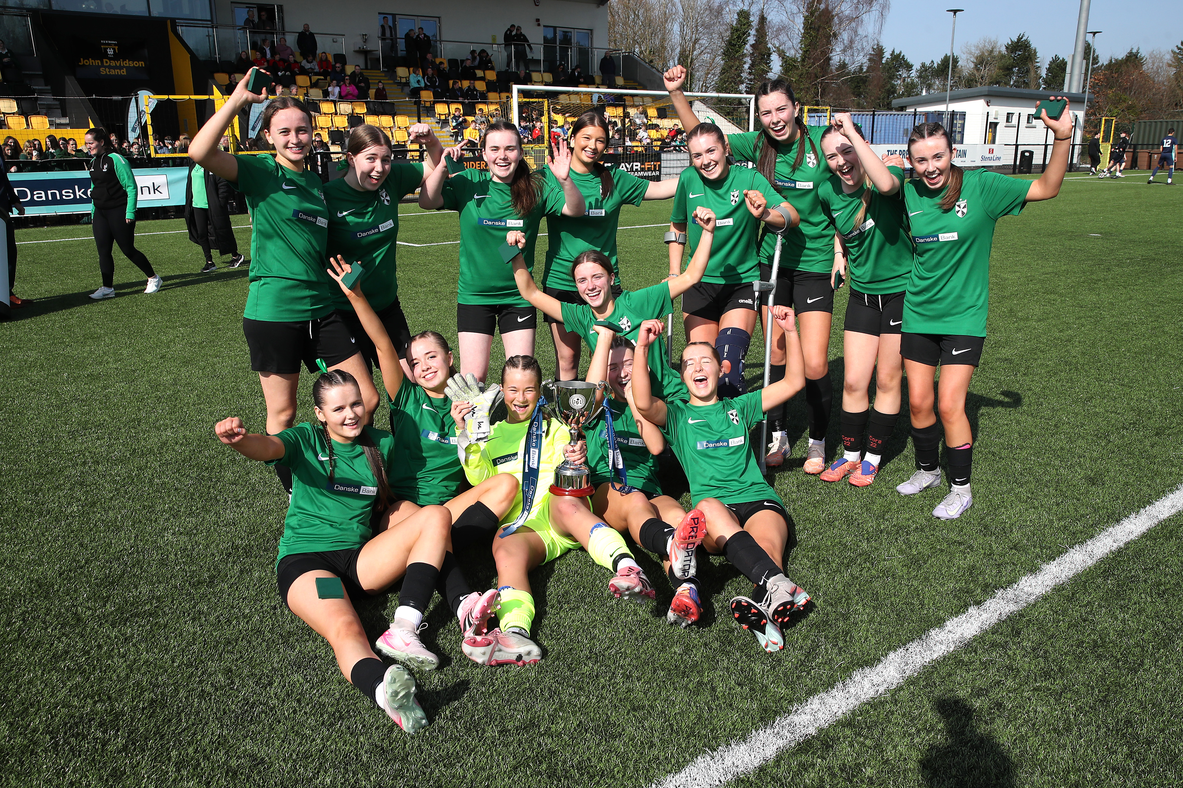 Girls' cup winners celebrate with the trophy